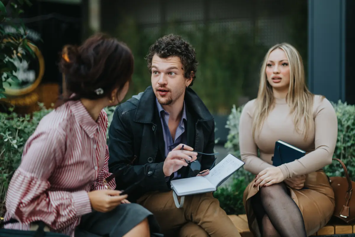 Questions To Ask A Wedding Venue Before You Book Wedding planning meeting focused on questions to ask a wedding venue about pricing, policies, and timeline